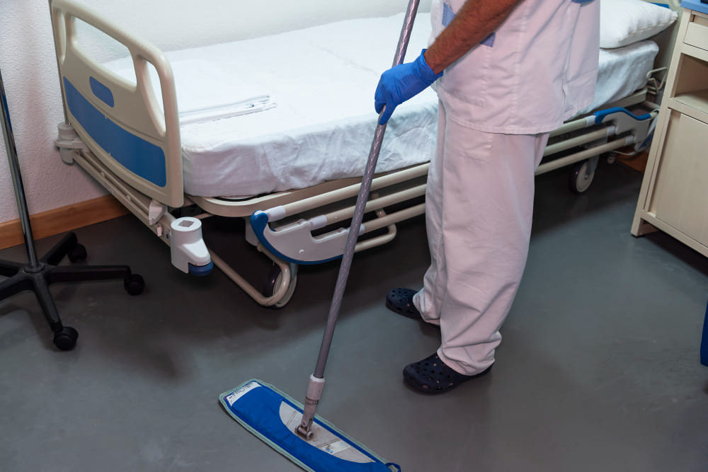 Professional cleaner sanitizing a healthcare facility in Allentown